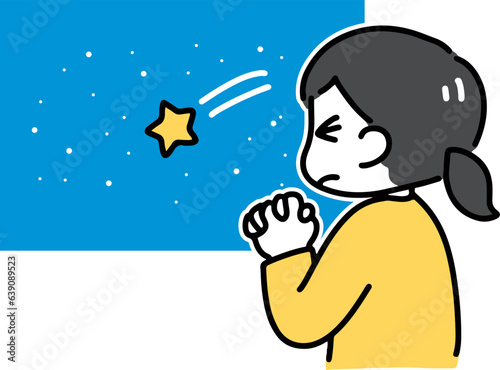 目を閉じて流れ星に願い事をする若い女性