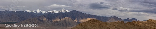 Panoramic view of high-altitude snowcapped mountain ranges of Ladakh, India 