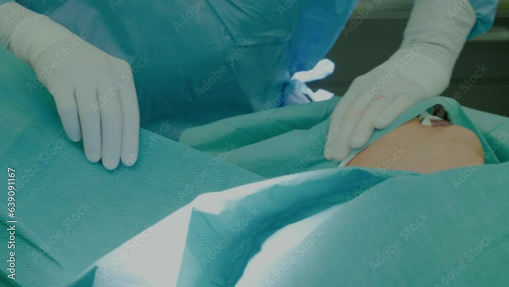 Doctors operate on a woman with cervical cancer on the operating table. Doctors operate on a woman with cervical cancer on the operating table.