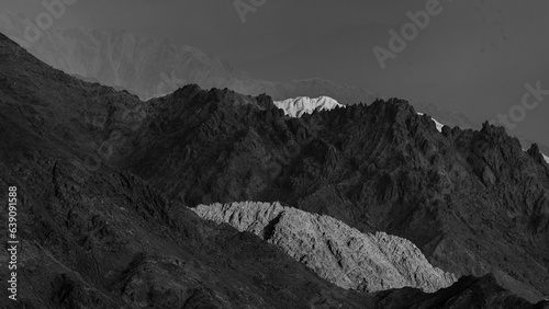 A panoramic landscape of light and shadows falling on mountains as fine art