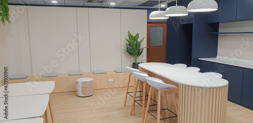 Fotografie Interior photography of a modern office breakout area with kitchen, blue and gre