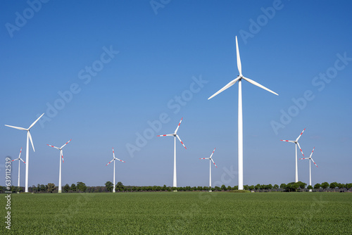 Modern wind turbines in an agricultural landscape seen in Germany