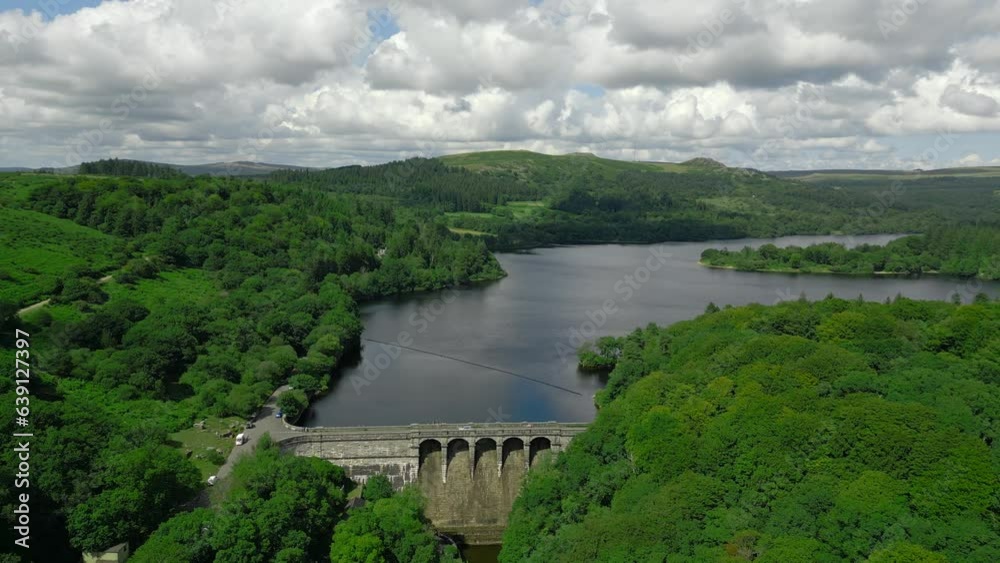 An aerial drone shot of Burrator Reservoir Dam at Dartmoor National Park, Devon. An aerial drone shot of Burrator Reservoir Dam at Dartmoor National Park, Devon.