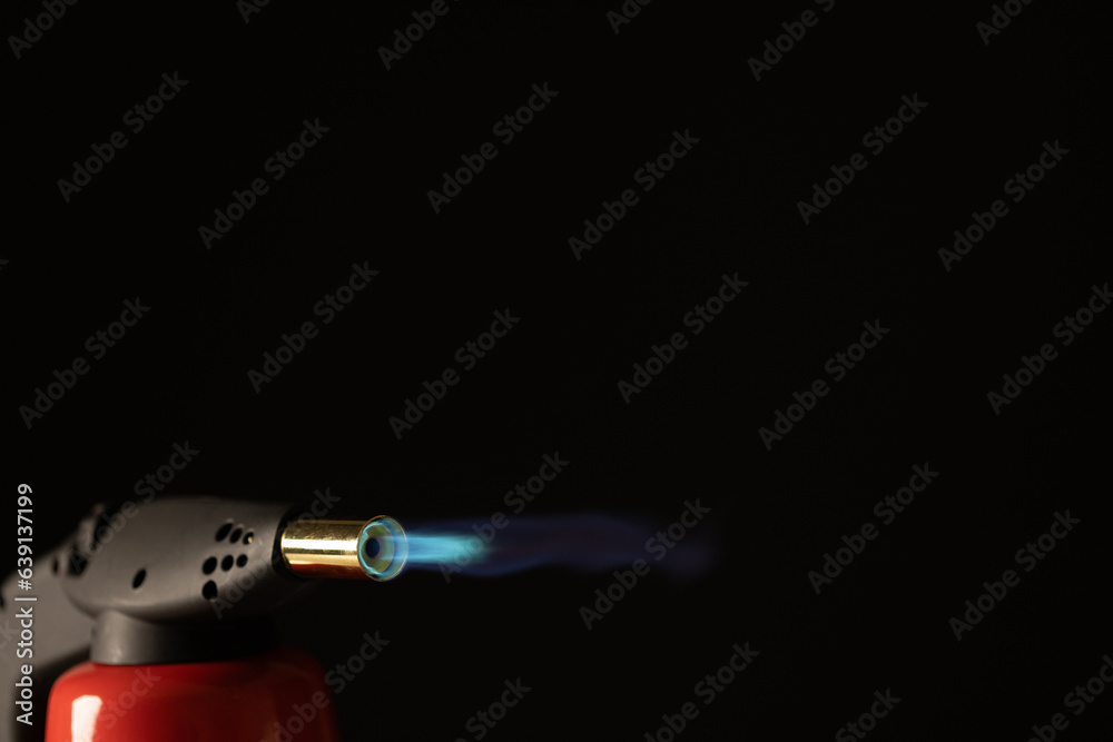 Close up of lit torch light with copy space on black background Close up of lit torch light with copy space on black background