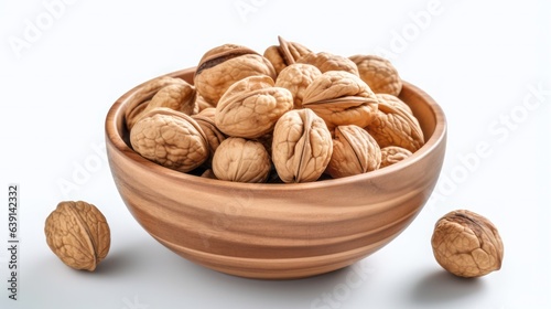 Walnut in a wooden bowl on a white background, created by Generative AI