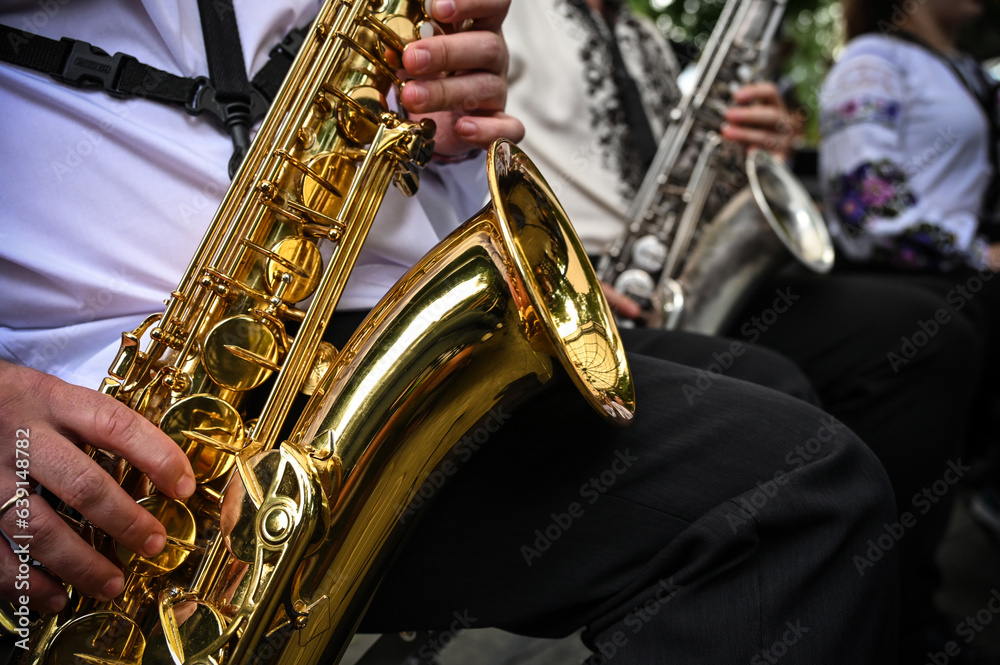Wind instruments orchestra in the foreground saxophone