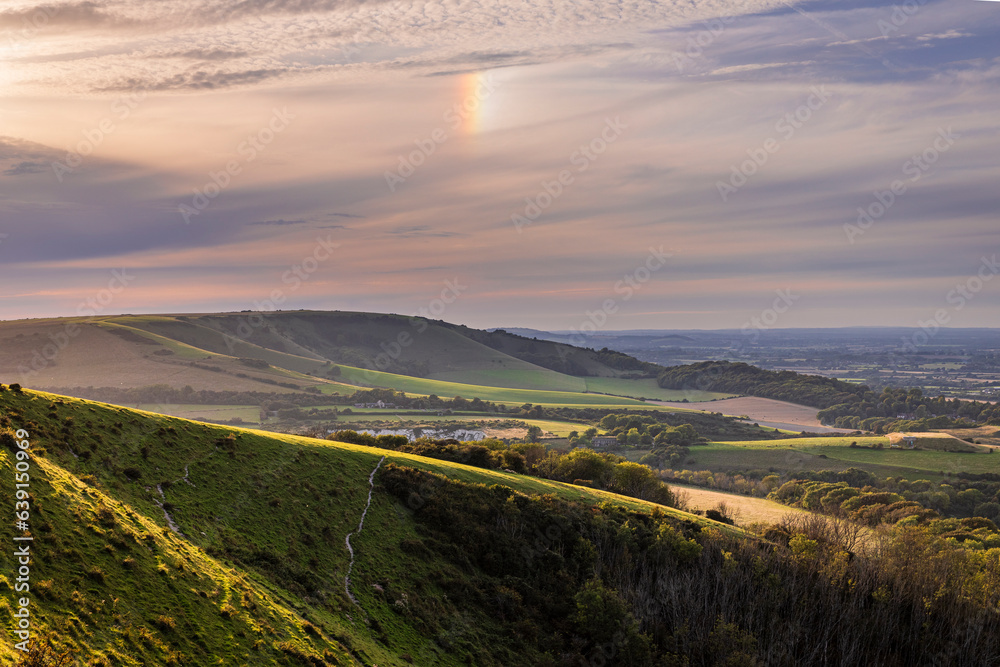 A sundog over Folkington Hill from Combe Hill Butts Brow on the south downs near Polegate east Sussex south east England UK