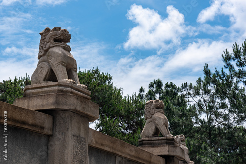 Stone lion sculpture on the Guangzhou Commune Martyrs  Cemetery in china. Historical site and Red tourism sites in china.