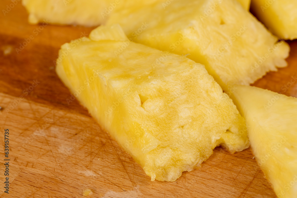 ripe yellow pineapple cut into pieces ripe yellow pineapple cut into pieces