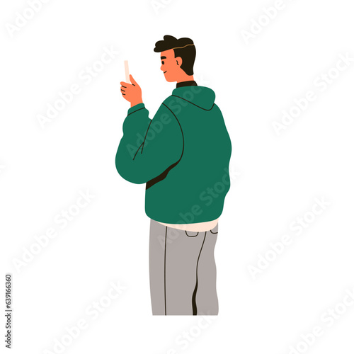 Happy man taking photo, photograph on mobile phone. Young person holding smar...