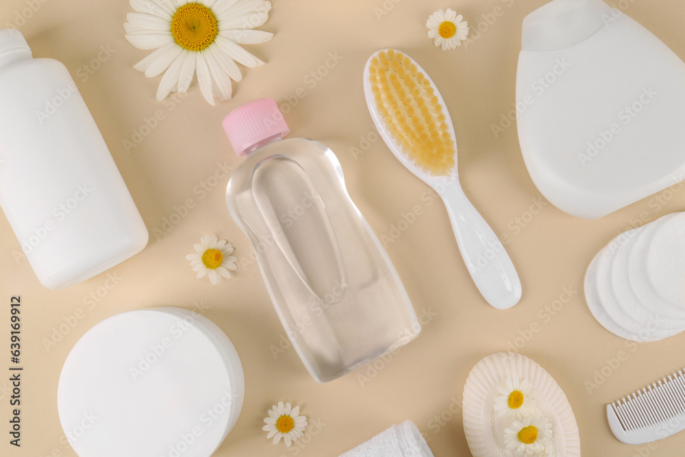 Flat lay composition with baby care products and accessories on beige background