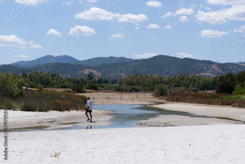 person walking on the river