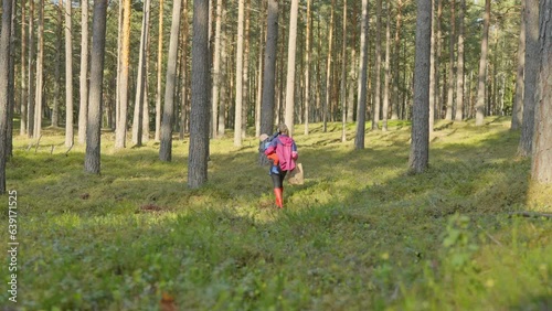 Mother taking her infant daughter for a picnic at Garkalne forest Latvia photo