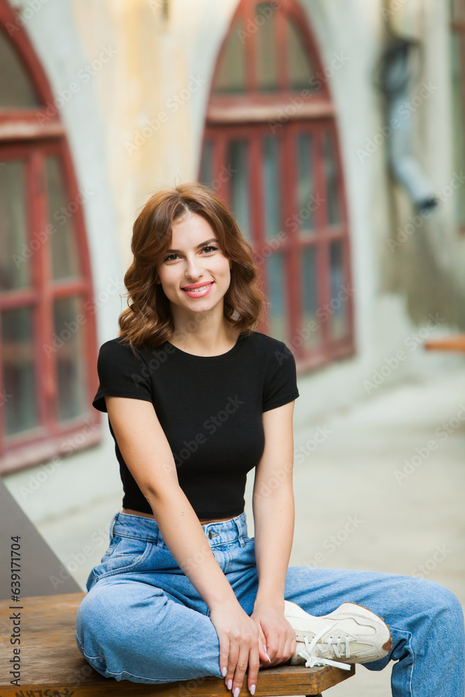 Close up portrait of a beautiful young woman smiling and looking at camera. White European girl with beautiful smile