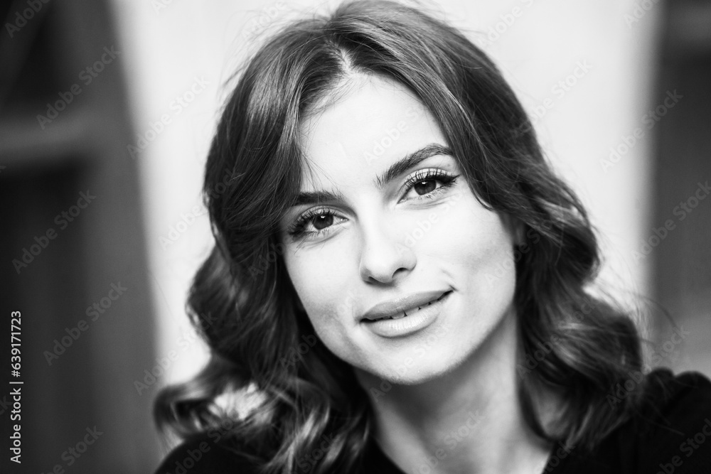 Close up portrait of a beautiful young woman smiling and looking at camera. White European girl with beautiful smile Close up portrait of a beautiful young woman smiling and looking at camera. White European girl with beautiful smile
