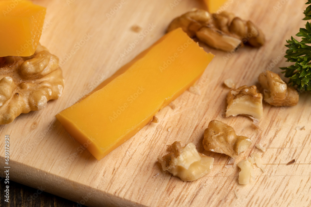 Fototapeta premium Sliced hard cheese made from milk