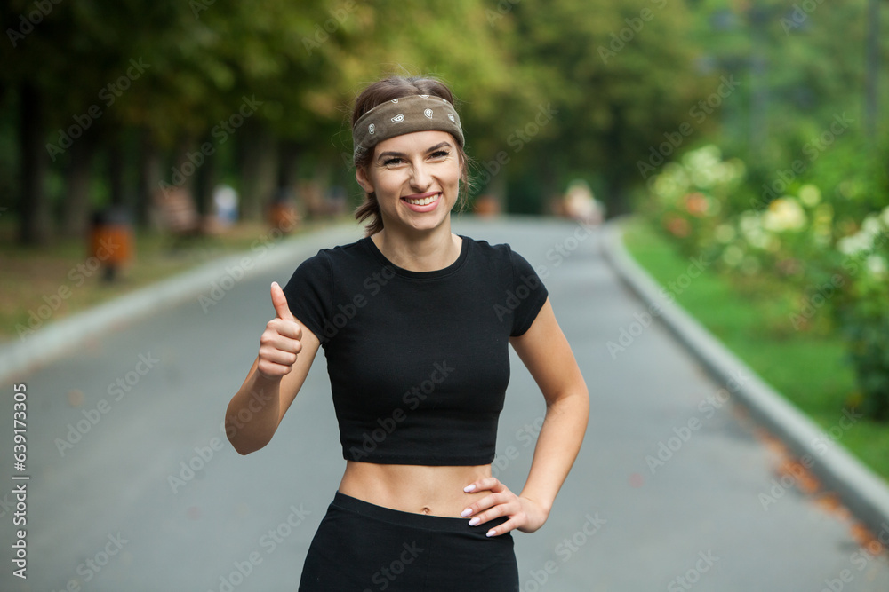 Athletic young woman in sportswear jogging in the park. Fitness and healthy lifestyle. Portrait of a beautiful young woman in sportswear outdoors. Sport fitness model caucasian ethnicity training outd Athletic young woman in sportswear jogging in the park. Fitness and healthy lifestyle. Portrait of a beautiful young woman in sportswear outdoors. Sport fitness model caucasian ethnicity training outd
