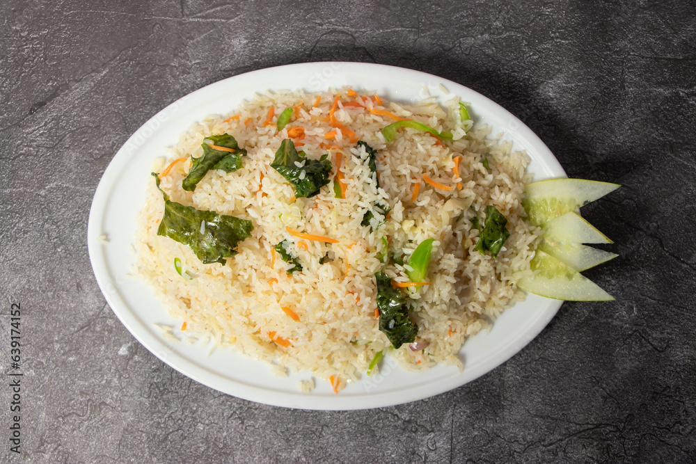 Vegetables Fried Rice with carrot served in dish isolated on background top view of bangladesh food