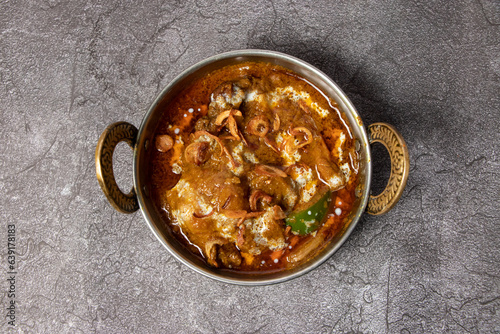 Mutton karahi, vindaloo, rogan josh, bhuna, korma masala gravy served in dish isolated on background top view of bangladesh food photo