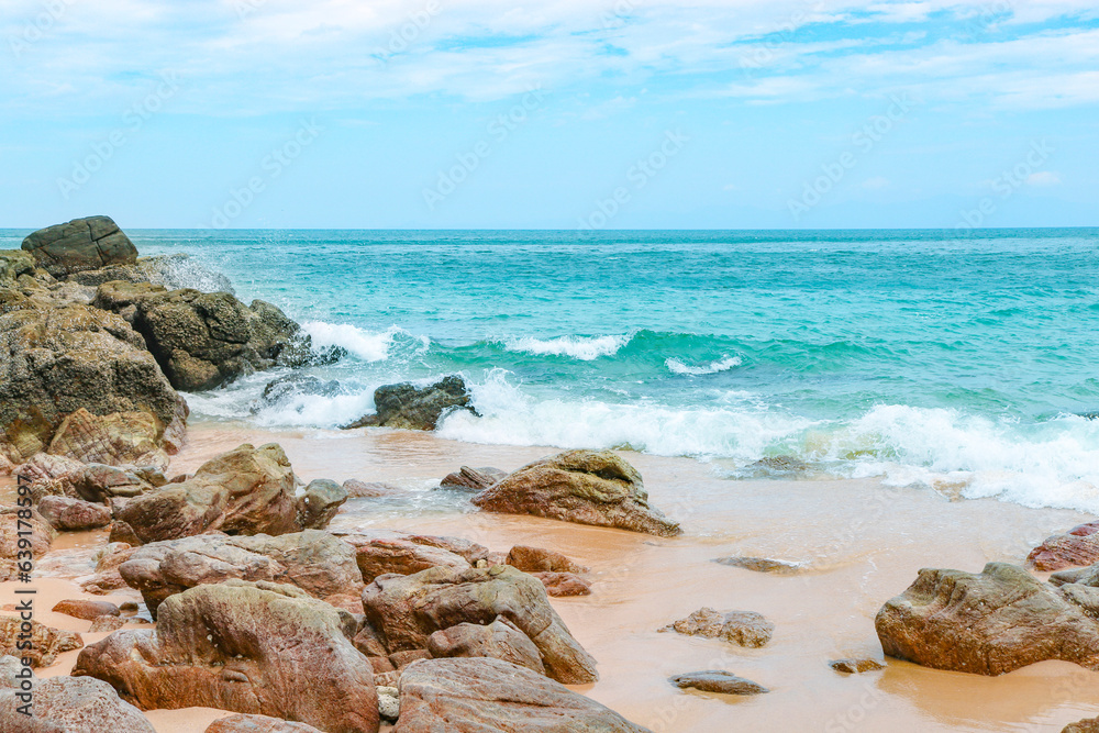 Tropical sandy rocky beach with clear clear blue water Tropical sandy rocky beach with clear clear blue water