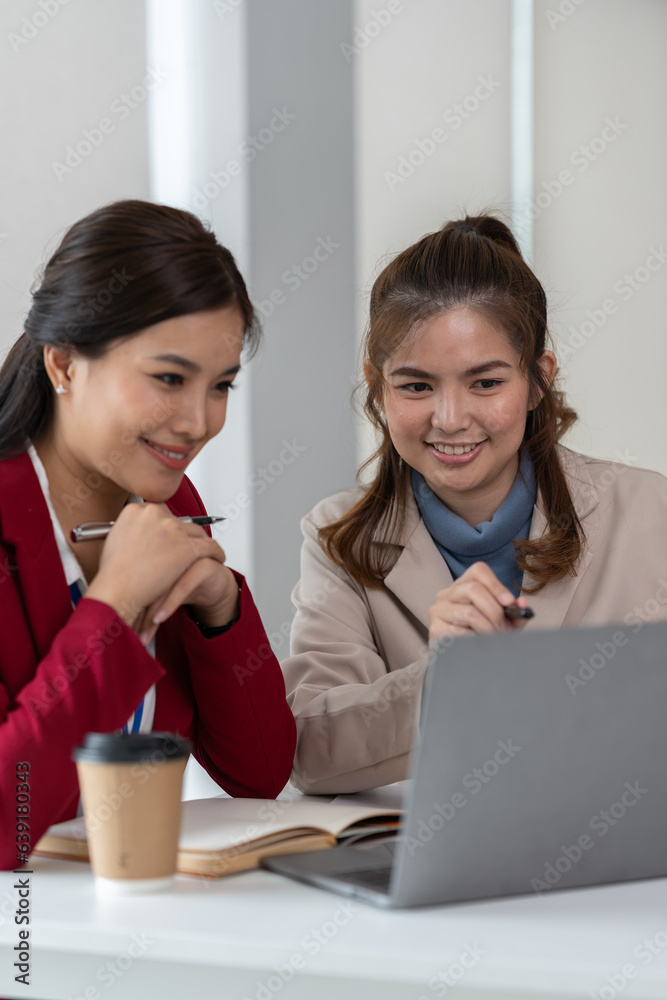 team work process Two asian businesswoman working with laptop computer and discussing documents project idea presentation Analyze the marketing plan. Investment in the office team work process Two asian businesswoman working with laptop computer and discussing documents project idea presentation Analyze the marketing plan. Investment in the office