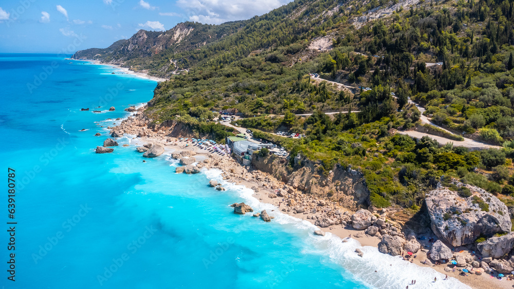 Aerial view from drone on the beautiful clear turquoise and blue water on the sandy Megali Petra beach in Lefkada. Greece