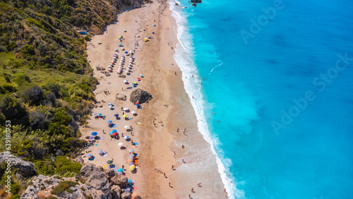 Aerial view from drone on the beautiful clear turquoise and blue water on the sandy Megali Petra beach in Lefkada. Greece