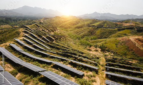 Aerial photography of solar photovoltaic cells built on a hillside