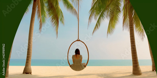 woman in a swing on two palm trees on the beach