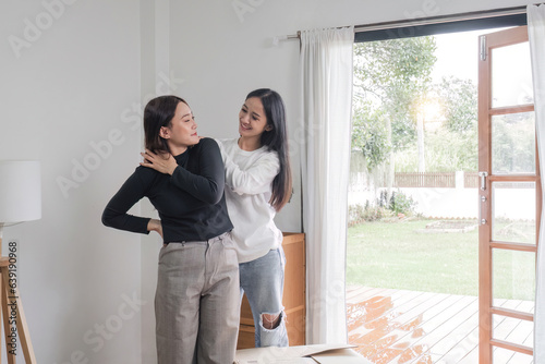 Young couple standing happily smiling on the day of moving house © wichayada