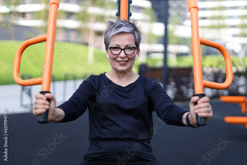 Joyful senior woman enjoys outdoor activity. Radiating health and positivity, she embraces a happy and active lifestyle.