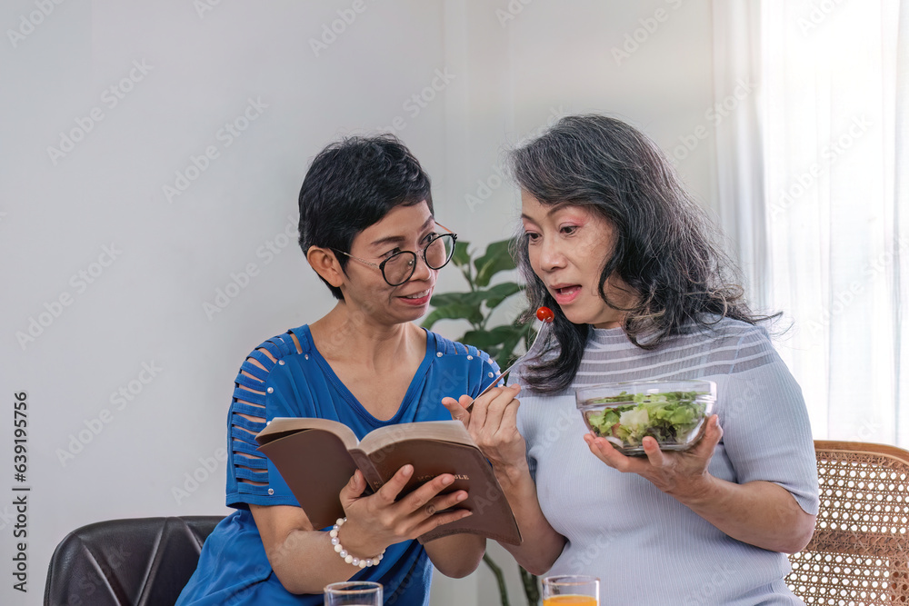 Two 60s woman enjoys talking with her friends and having a healthy food together. Two 60s woman enjoys talking with her friends and having a healthy food together.