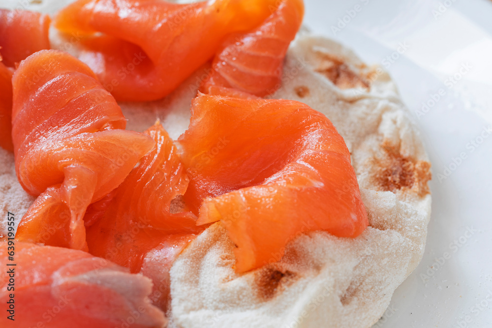 Macro close up of italian 'Pinsa' with smoked salmon. Macro close up of italian 'Pinsa' with smoked salmon.