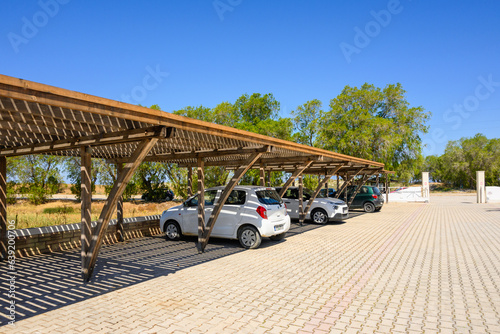 Kos, Greece - May 8, 2023: Typical sun protection for cars in a parking lot in Greece.
