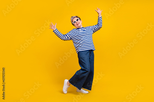 Photo of positive crazy carefree lady wear stylish outfit have fun rejoice black friday discount isolated on yellow color background