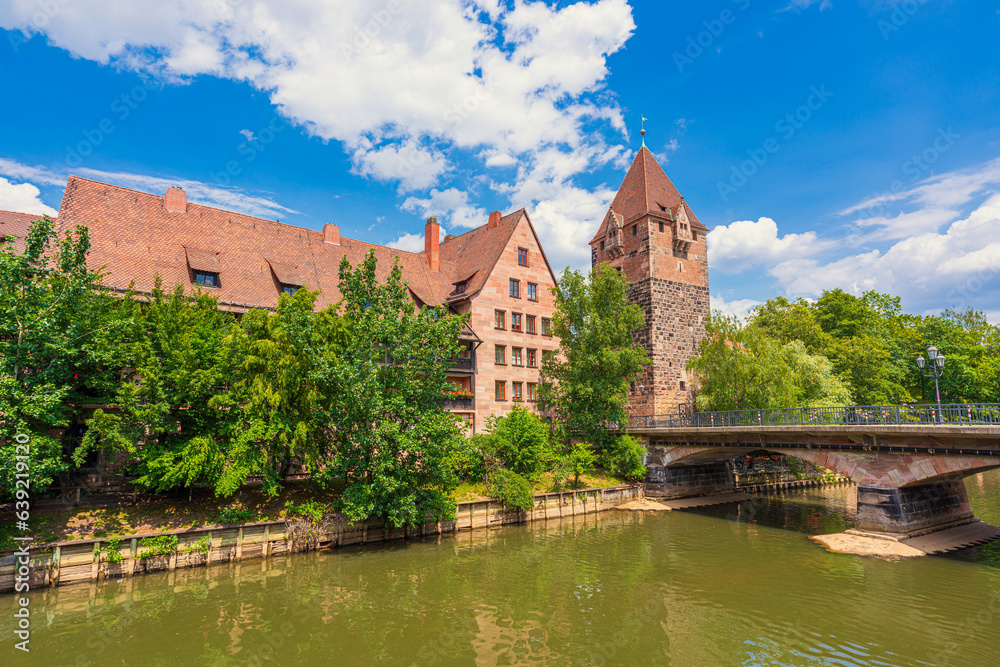 View of Nuremberg Old Town featuring the River Pegnitz, Heubrücke, Schuldturm and other old buildings.
