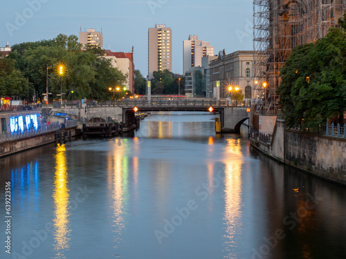 View of the city river at the cathedral in Berlin at sunset. Landscape of the evening city