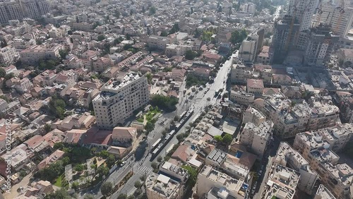 Jerusalem tram light rail train and city street aerial drone view, Jaffa street, Israel