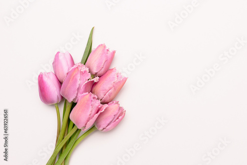 Bouquet of pink tulip flowers on a gray background. Copy space.