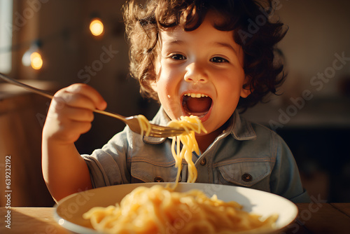 Obraz na płótnie Cute little kid boy eating spaghetti bolognese or pasta macaroni bolognese at home