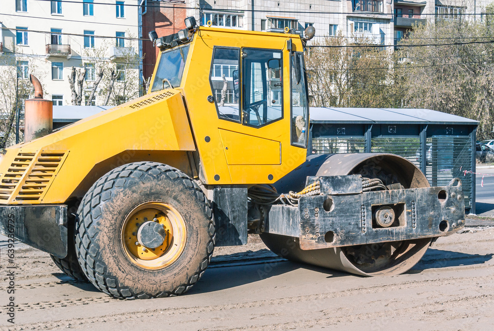 Road roller for road construction. Asphalt concrete roller for compaction of soil and foundations in road construction. Equipment for road works. Road construction.