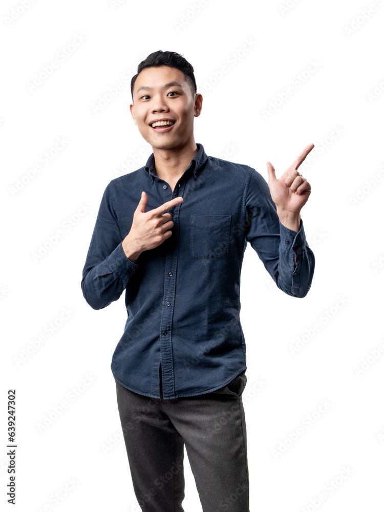 A portrait of an Asian man wearing a blue shirt, looking happy and posing as if shooting with a hand gesture resembling a gun. Isolated with a white background. A portrait of an Asian man wearing a blue shirt, looking happy and posing as if shooting with a hand gesture resembling a gun. Isolated with a white background.