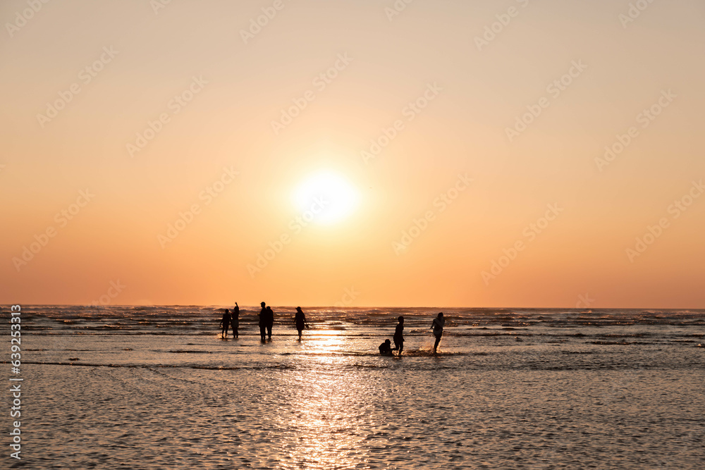 silhouette of a people on the beach