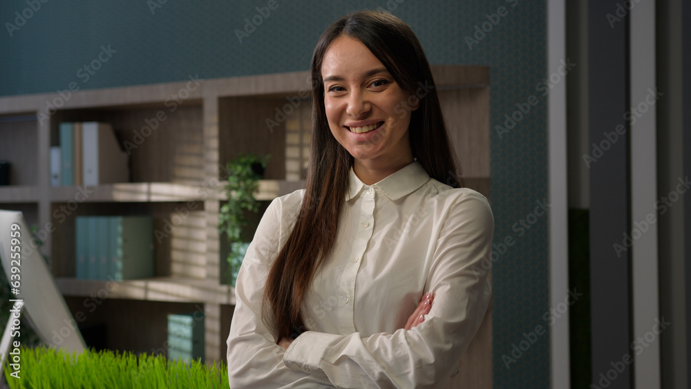 Female business portrait confident Caucasian businesswoman posing in office with hands crossed Caucasian girl smiling happy woman smile at workplace lady employer entrepreneur company owner manager Female business portrait confident Caucasian businesswoman posing in office with hands crossed Caucasian girl smiling happy woman smile at workplace lady employer entrepreneur company owner manager