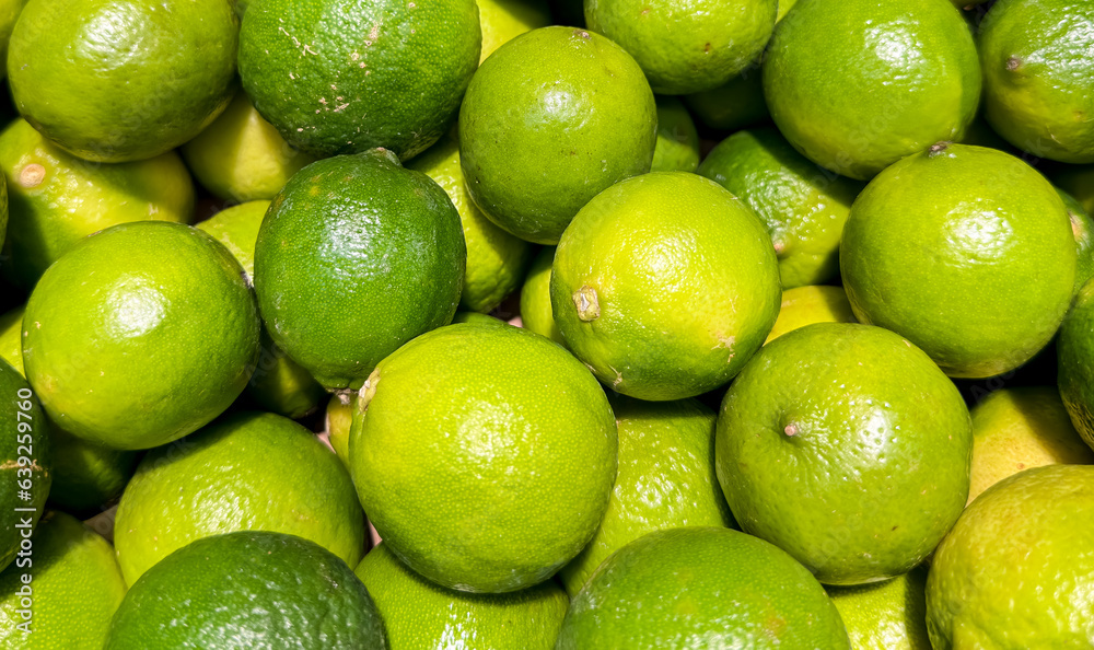 Limes. Green and ripe limes theme. Limes background. Limes. Green and ripe limes theme. Limes background.