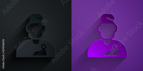 Paper cut Wizard warlock icon isolated on black on purple background. Paper art style. Vector