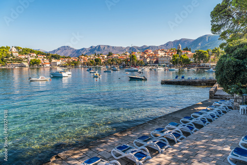 Fototapeta Naklejka Na Ścianę i Meble -  Scenic view of beach in Croatia with looks over Adriatic sea and the small village of Cavtat near Dubrovnik 