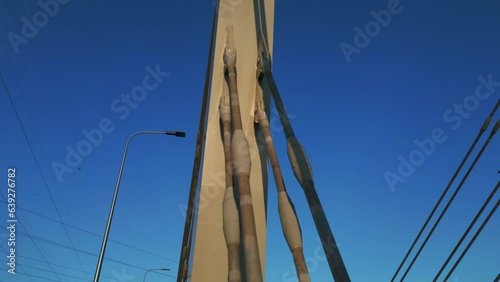 modern metal cable bridge on blue sky background at sunset, Lublin, 4k photo