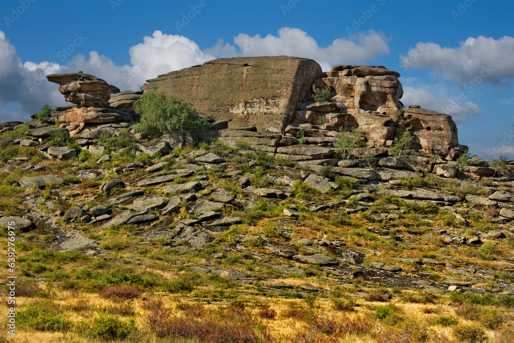 East Kazakhstan. Picturesque view of the ruins of the mountains of the Bayanaul Natural Park, located in the middle of the endless steppes.