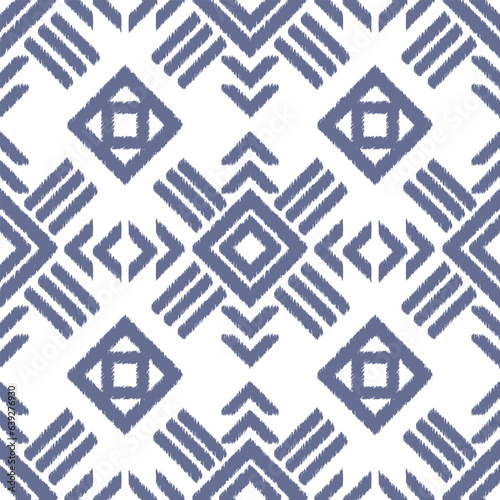 Seamless ikat pattern with blue geometric elements.